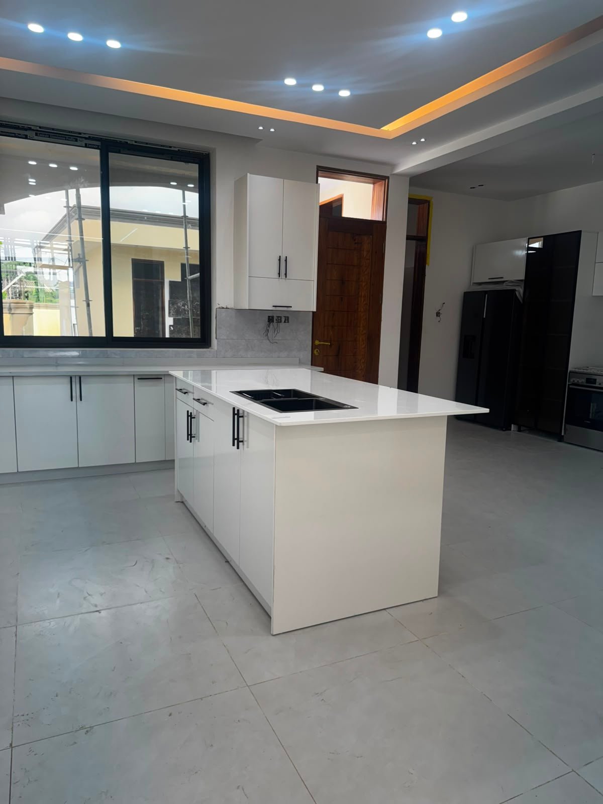 Custom White Kitchen with Island in Tanzania | StarDecor